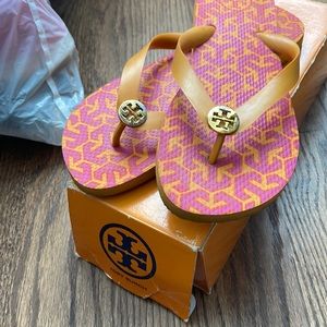 Gently worn Tory Burch orange and pink flip flops